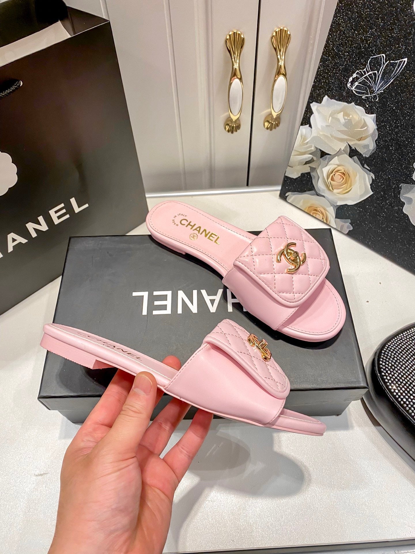 Luxury diamond-quilted flat slides with metal embellishments