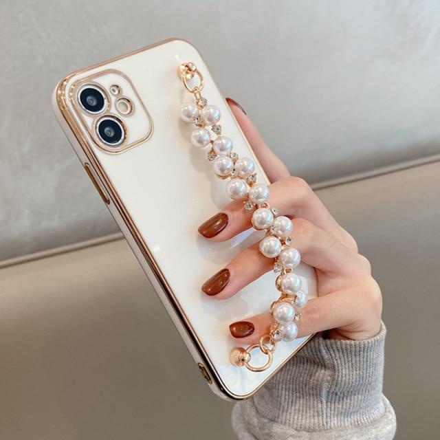 Coque et skin iPhone avec chaîne de perles brillantes